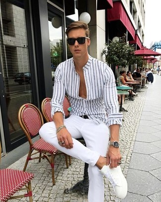 White and Blue Vertical Striped Dress Shirt Smart Casual Outfits For Men: A white and blue vertical striped dress shirt and white chinos are the kind of a tested combo that you need when you have no time. Add a relaxed twist to this ensemble by finishing with white leather low top sneakers.