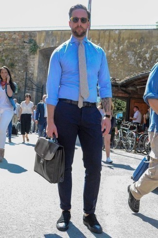 Men's Light Blue Chambray Dress Shirt, Navy Chinos, Black Canvas Low Top Sneakers, Charcoal Leather Briefcase