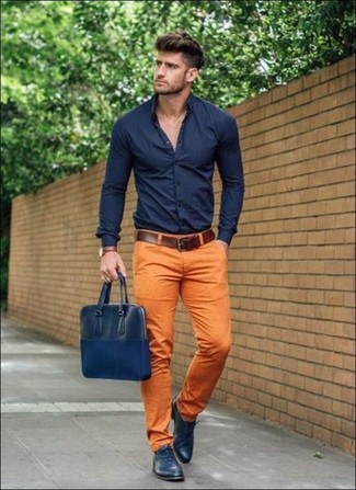 Navy Leather Messenger Bag Outfits: You'll be amazed at how easy it is for any gentleman to put together a city casual ensemble like this. Just a navy dress shirt matched with a navy leather messenger bag. Navy leather oxford shoes are an effective way to add a little kick to the outfit.