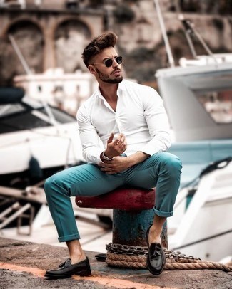 Aquamarine Chinos Outfits: This combination of a white dress shirt and aquamarine chinos speaks rugged elegance and versatility. Black leather tassel loafers will infuse a touch of refinement into an otherwise simple getup.