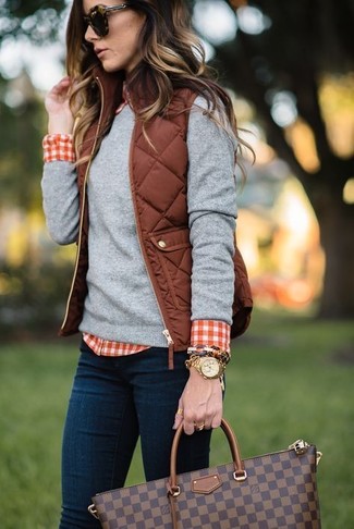 Women's Navy Skinny Jeans, Red and White Gingham Dress Shirt, Grey Crew-neck Sweater, Brown Quilted Gilet