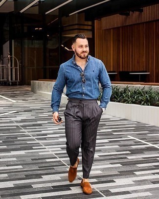 Charcoal Vertical Striped Dress Pants Outfits For Men: Team a blue chambray dress shirt with charcoal vertical striped dress pants - this look will certainly make an entrance. Let your outfit coordination sensibilities truly shine by finishing off this outfit with tobacco suede loafers.