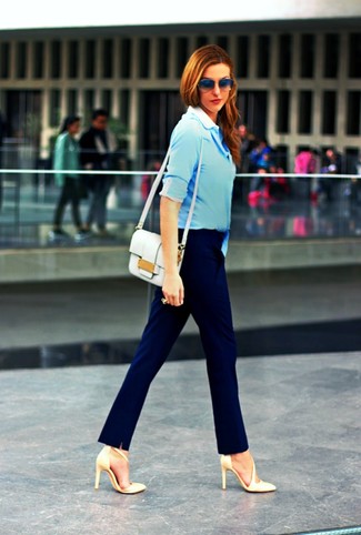 Navy Dress Pants Outfits For Women: A light blue dress shirt and navy dress pants? Make no mistake, this ensemble will make every jaw drop and heart stop. If you're on the fence about how to finish off, add a pair of beige leather pumps to the mix.