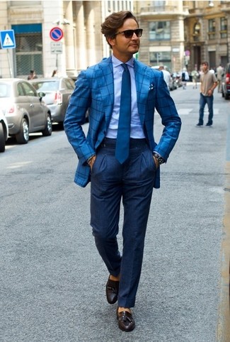 Blue Tie Outfits For Men: Hard proof that a light blue dress shirt and a blue tie look amazing when matched together in a refined look for a modern gentleman. Dark brown leather tassel loafers add a little edge to an otherwise mostly classic ensemble.