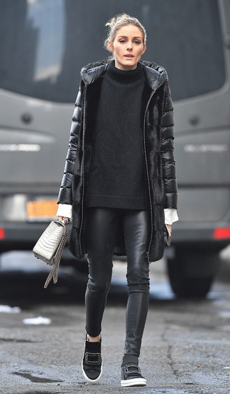 Olivia Palermo wearing Black Leather Skinny Pants, White Dress Shirt, Black Knit Oversized Sweater, Black Puffer Coat