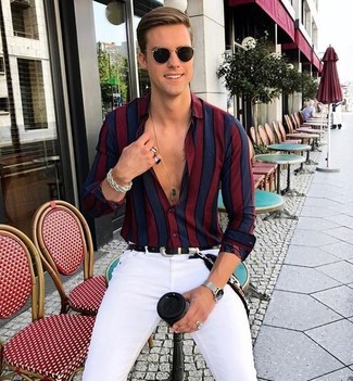 White Skinny Jeans Outfits For Men: Display your prowess in menswear styling by teaming a red and navy vertical striped dress shirt and white skinny jeans for an off-duty look.