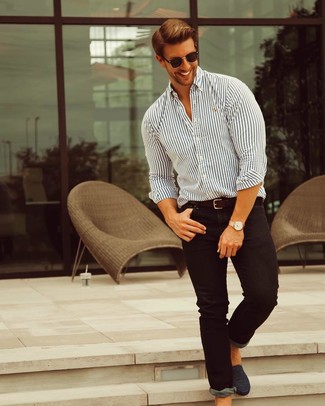 White and Navy Vertical Striped Dress Shirt Outfits For Men: Go for a simple but at the same time casually cool choice pairing a white and navy vertical striped dress shirt and black skinny jeans. Infuse your look with a dash of class by rocking black leather loafers.