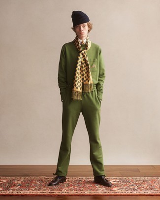 Olive Track Suit Outfits For Men: Show off your prowess in menswear styling by marrying an olive track suit and a white dress shirt for an off-duty ensemble. A pair of dark brown leather tassel loafers will give an elegant twist to this ensemble.
