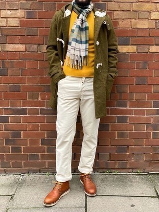 Mustard Crew-neck Sweater Outfits For Men: Why not wear a mustard crew-neck sweater with white jeans? As well as totally functional, both of these pieces look cool when married together. Our favorite of a multitude of ways to complete this look is tobacco leather desert boots.
