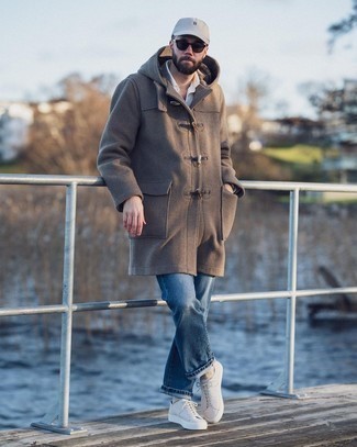 Duffle Coat Outfits For Men: Pair a duffle coat with blue jeans to assemble an interesting and modern-looking outfit. Rev up the style factor of this ensemble by rocking a pair of white canvas low top sneakers.