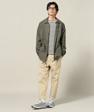 Dark Green Field Jacket Outfits: A dark green field jacket and khaki chinos married together are a smart match. For something more on the casually cool side to finish off this look, throw a pair of grey athletic shoes into the mix.