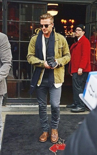 David Beckham wearing Olive Field Jacket, Charcoal Crew-neck T-shirt, Charcoal Skinny Jeans, Brown Leather Derby Shoes