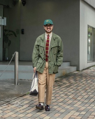 Olive Field Jacket Outfits: Showcase your chops in menswear styling by teaming an olive field jacket and khaki chinos for an off-duty combination. Dial down the casualness of this look by finishing with a pair of burgundy leather loafers.