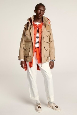 Orange Gilet Outfits For Men: This pairing of an orange gilet and white chinos is the ultimate off-duty ensemble for today's gentleman. Complement this ensemble with a pair of beige leather boat shoes and ta-da: the getup is complete.