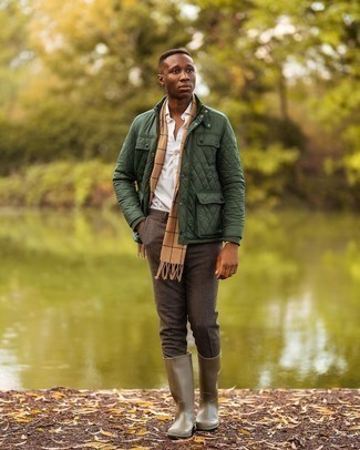 Dark Brown Wool Chinos Outfits: A dark green quilted field jacket and dark brown wool chinos are a nice combo that will take you throughout the day. Balance out this look with a more polished kind of shoes, like this pair of olive rain boots.