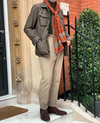 Orange Scarf Outfits For Men: If you're all about feeling comfortable when it comes to your personal style, this pairing of a brown field jacket and an orange scarf is totally for you. Serve a little outfit-mixing magic by finishing with dark brown suede desert boots.