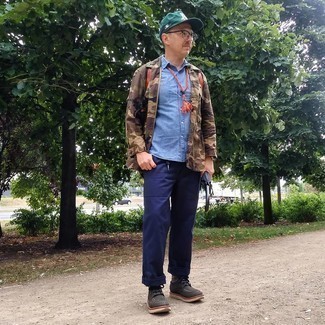 Olive Print Baseball Cap Outfits For Men: If you appreciate practicality above all, this modern casual combo of a brown camouflage field jacket and an olive print baseball cap is your go-to. A pair of dark brown leather derby shoes easily bumps up the fashion factor of your ensemble.