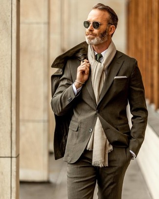 Olive Suit Outfits: For an ensemble that's smart and envy-worthy, pair an olive suit with an olive leather field jacket.
