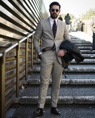 Dark Brown Horizontal Striped Tie Outfits For Men: This refined combination of a black field jacket and a dark brown horizontal striped tie is a popular choice among the sartorially superior chaps. In the footwear department, go for something on the smarter end of the spectrum by wearing black leather tassel loafers.