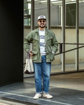 White and Navy Print Baseball Cap Outfits For Men: An olive field jacket and a white and navy print baseball cap are a nice combo to have in your casual styling routine. Here's how to play it up: white canvas low top sneakers.