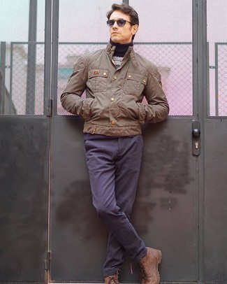 Beige Field Jacket Outfits: Marry a beige field jacket with navy chinos for a day-to-day getup that's full of charm and personality. Want to play it up on the shoe front? Complete your ensemble with brown leather casual boots.