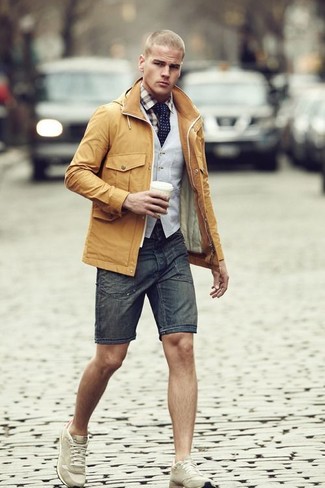 Grey Waistcoat Outfits: Wear a grey waistcoat and charcoal denim shorts for a chic and elegant look. If you want to immediately dress down this ensemble with a pair of shoes, why not complete this outfit with beige athletic shoes?