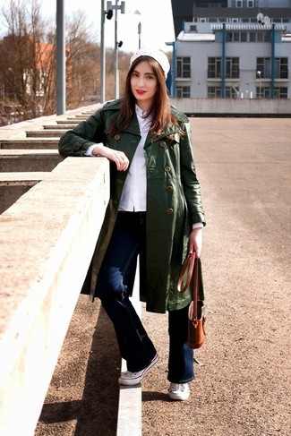 Women's White Canvas Low Top Sneakers, Navy Flare Jeans, White Dress Shirt, Dark Green Leather Trenchcoat