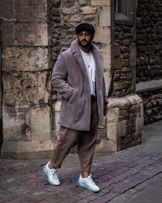Brown Chinos Winter Outfits: This relaxed casual combo of a grey fur coat and brown chinos is a goofproof option when you need to look cool in a flash. Introduce a pair of white athletic shoes to the mix to make a sober look feel suddenly fresh. You can bet this combo is great come winter season.