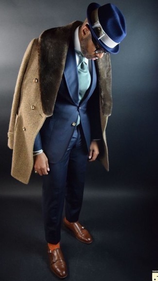 Tan Fur Collar Coat Outfits For Men: This elegant combo of a tan fur collar coat and a navy suit is a common choice among the sartorially superior chaps. Wondering how to round off? Complete your ensemble with a pair of brown leather double monks to mix things up a bit.