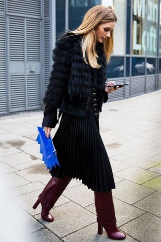 Olivia Palermo wearing Black Fur Jacket, Black Button Down Blouse, Black Pleated Midi Skirt, Burgundy Leather Knee High Boots