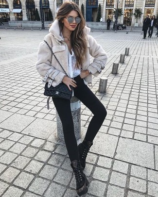 Beige Fur Jacket Outfits: Such staples as a beige fur jacket and black skinny jeans are the perfect way to inject effortless cool into your daily casual arsenal. When this ensemble looks all-too-classic, play it down with a pair of black suede lace-up flat boots.