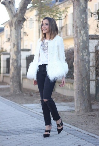 This combination of a white fur jacket and black ripped skinny jeans is super versatile and really up for whatever the day throws at you. Black suede pumps are guaranteed to inject an added touch of class into this getup.