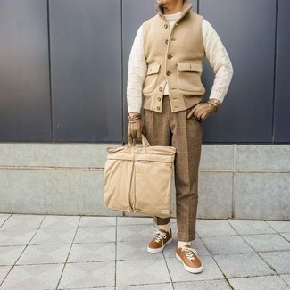Khaki Plaid Dress Pants Outfits For Men: A tan wool gilet and khaki plaid dress pants are among the crucial elements in any gent's functional wardrobe. Complete this ensemble with tobacco leather low top sneakers to inject a dose of stylish effortlessness into your outfit.