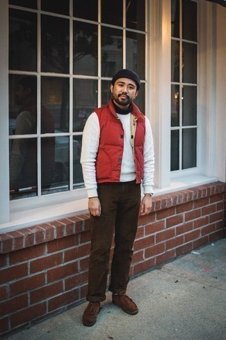 Navy Beanie Outfits For Men: Extremely dapper and functional, this combination of a red quilted gilet and a navy beanie provides with variety. Add a pair of brown suede desert boots to this getup for an extra touch of style.