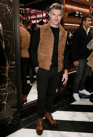 Dark Brown Gilet Outfits For Men: A dark brown gilet and black chinos married together are a good match. Make your outfit slightly more elegant by finishing off with brown leather casual boots.