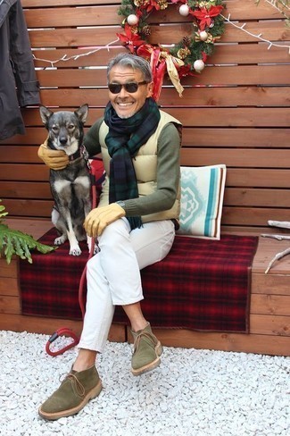 Tan Quilted Gilet Outfits For Men: This pairing of a tan quilted gilet and white jeans will allow you to assert your expertise in men's fashion even on dress-down days. Why not add olive suede desert boots to the mix for an air of elegance?