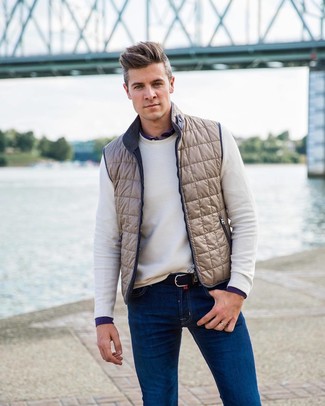 Beige Gilet Outfits For Men: If you feel more confident wearing something comfortable, you'll like this on-trend combination of a beige gilet and blue jeans.