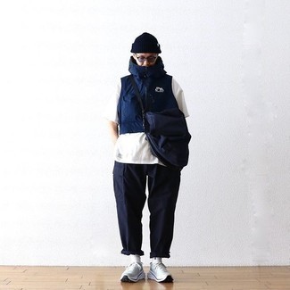 Navy Canvas Messenger Bag Outfits: If the situation permits casual urban style, consider teaming a navy gilet with a navy canvas messenger bag. White athletic shoes complement this outfit very well.