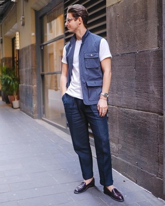 Blue Gilet Outfits For Men: Putting together a blue gilet with navy dress pants is an on-point pick for a classic and elegant getup. The whole look comes together perfectly when you complement your look with burgundy leather loafers.