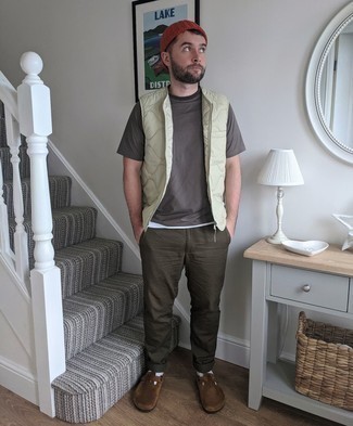 Dark Brown Suede Loafers Outfits For Men: For relaxed dressing with a modern twist, marry a beige quilted gilet with dark brown chinos. Tap into some Idris Elba dapperness and complement this look with dark brown suede loafers.