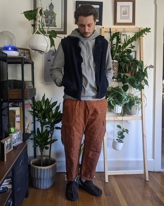 Tobacco Cargo Pants Outfits: For a laid-back menswear style with a fashionable spin, try teaming a navy fleece gilet with tobacco cargo pants. A cool pair of black canvas loafers is a simple way to add a confident kick to the ensemble.