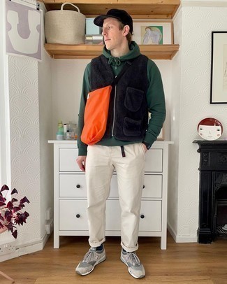 Gilet Outfits For Men: A gilet and white chinos are among the crucial elements in any gentleman's great casual collection. A pair of grey athletic shoes can easily dress down an all-too-refined outfit.