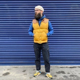 Orange Gilet Outfits For Men: An orange gilet and charcoal jeans are the perfect foundation for a casually dapper ensemble. Rounding off with a pair of mustard athletic shoes is the simplest way to infuse a more laid-back aesthetic into this outfit.
