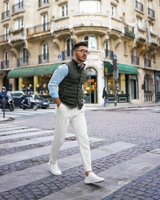 Dark Green Gilet Outfits For Men: This pairing of a dark green gilet and white chinos brings comfort and utility and helps keep it low-key yet current. Why not introduce a pair of white canvas low top sneakers to the mix for a more casual spin?