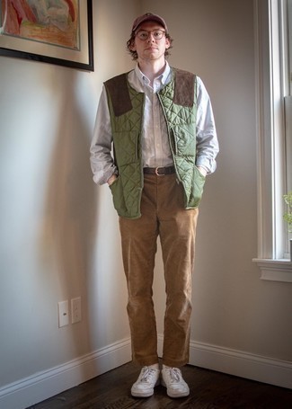 Men's Olive Quilted Gilet, Light Blue Vertical Striped Long Sleeve Shirt, Khaki Corduroy Chinos, White Leather Low Top Sneakers
