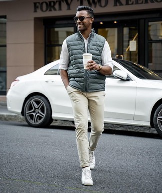 Men's Dark Green Quilted Gilet, White Long Sleeve Shirt, Beige Chinos, White Canvas Low Top Sneakers