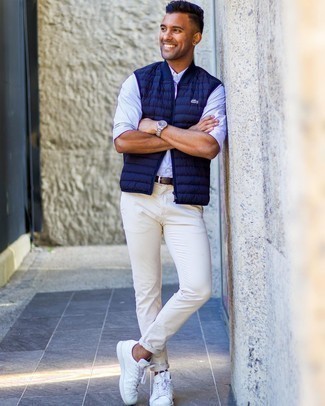 Light Blue Vertical Striped Long Sleeve Shirt Outfits For Men: A light blue vertical striped long sleeve shirt and white chinos are stylish menswear pieces, without which our wardrobes would surely feel incomplete. All you need now is a nice pair of white leather low top sneakers.