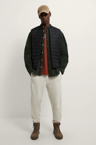 Black Quilted Gilet Outfits For Men: Display your credentials in menswear styling by combining a black quilted gilet and white sweatpants for an off-duty combo. If you need to effortlessly dress down your outfit with a pair of shoes, why not complement your getup with a pair of brown suede work boots?