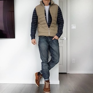 Beige Quilted Gilet Outfits For Men: Rock a beige quilted gilet with charcoal jeans to pull together a neat and relaxed outfit. Finishing off with brown suede high top sneakers is a guaranteed way to bring a carefree vibe to your ensemble.