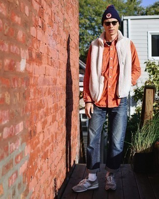 Orange Long Sleeve Shirt Outfits For Men: For a laid-back and cool ensemble, consider pairing an orange long sleeve shirt with navy jeans — these pieces play perfectly well together. Infuse a more laid-back vibe into your look with a pair of grey athletic shoes.